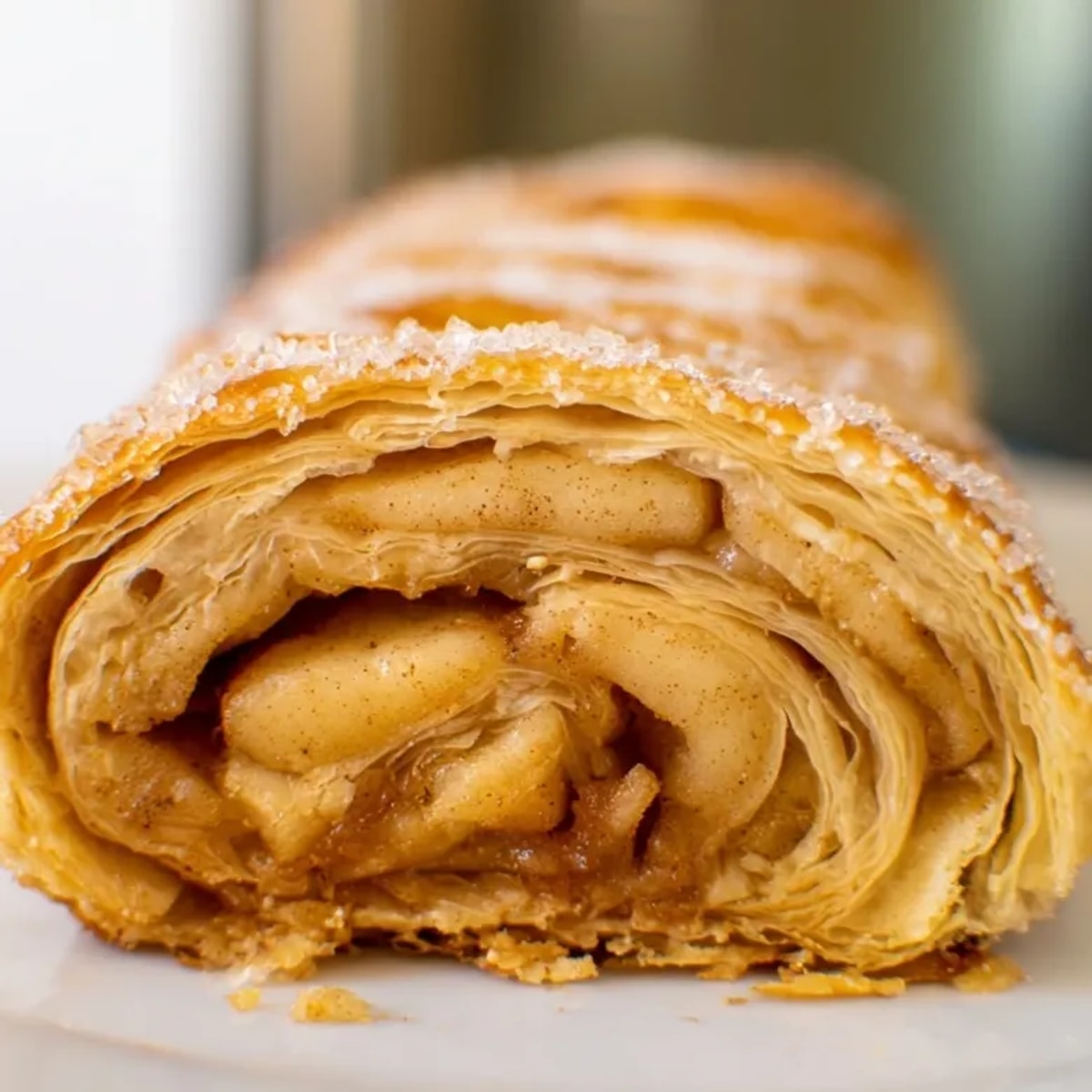 Close-up of glazed 3-Ingredient Apple Pie Rolls, a quick recipe ready to enjoy.