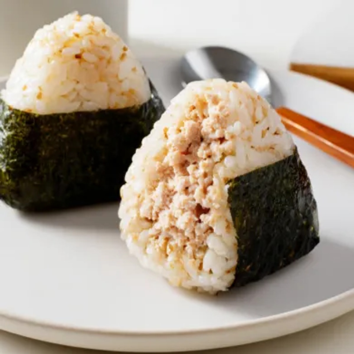 Golden Japanese rice surrounds a delicious filling, Nori wrapped, these Tuna Rice Balls are ready.