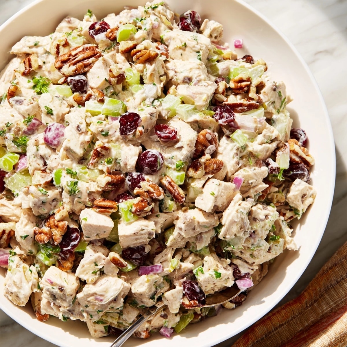 Close-up of Cranberry Pecan Chicken Salad: a sweet, savory blend with visible cranberries.