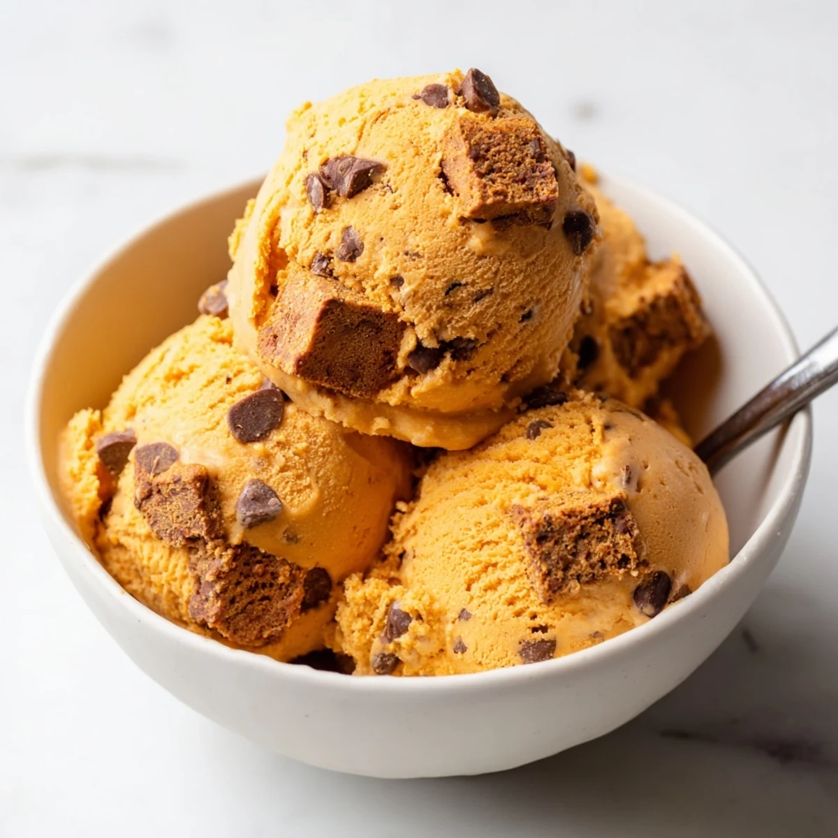 Indulge in Pumpkin Chocolate Chip Muffin Ice Cream, a delightful autumn treat.  