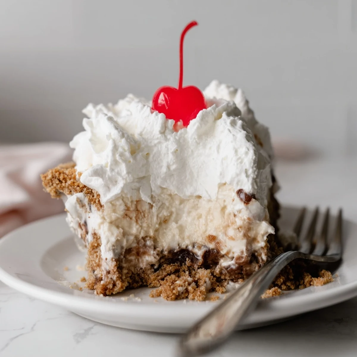 Chilled Classic Diner Coke Float Pie with fizzy cola filling and sweet cherry garnish.