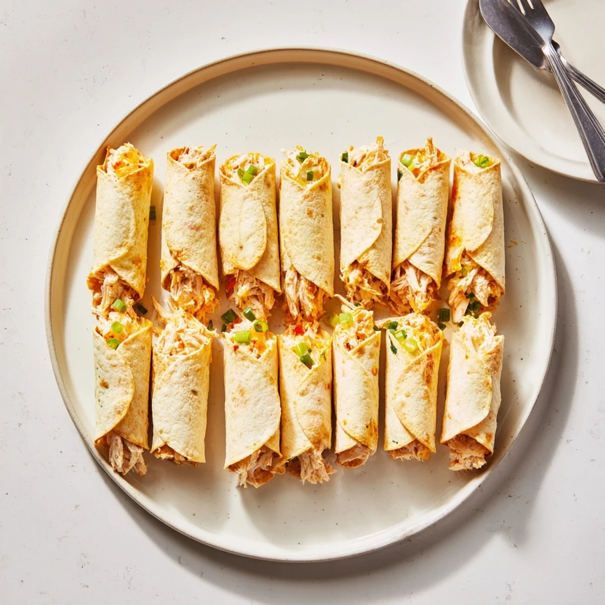 Delicious cream cheese chicken taquitos, golden-brown, perfect for quick weeknight dinners. 