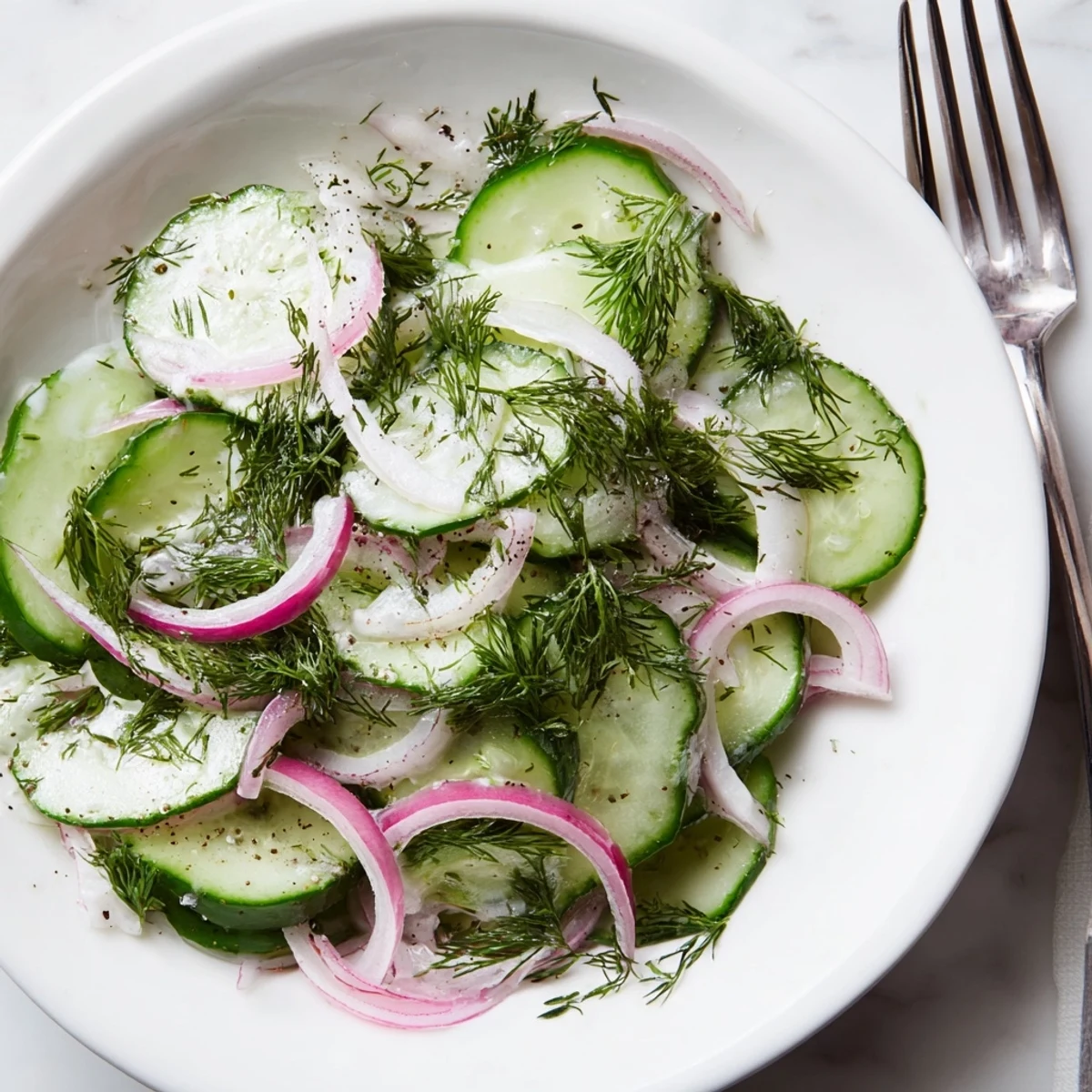 Bright and refreshing Lemon Dill Cucumber Salad, the perfect summer side dish with vibrant colors.