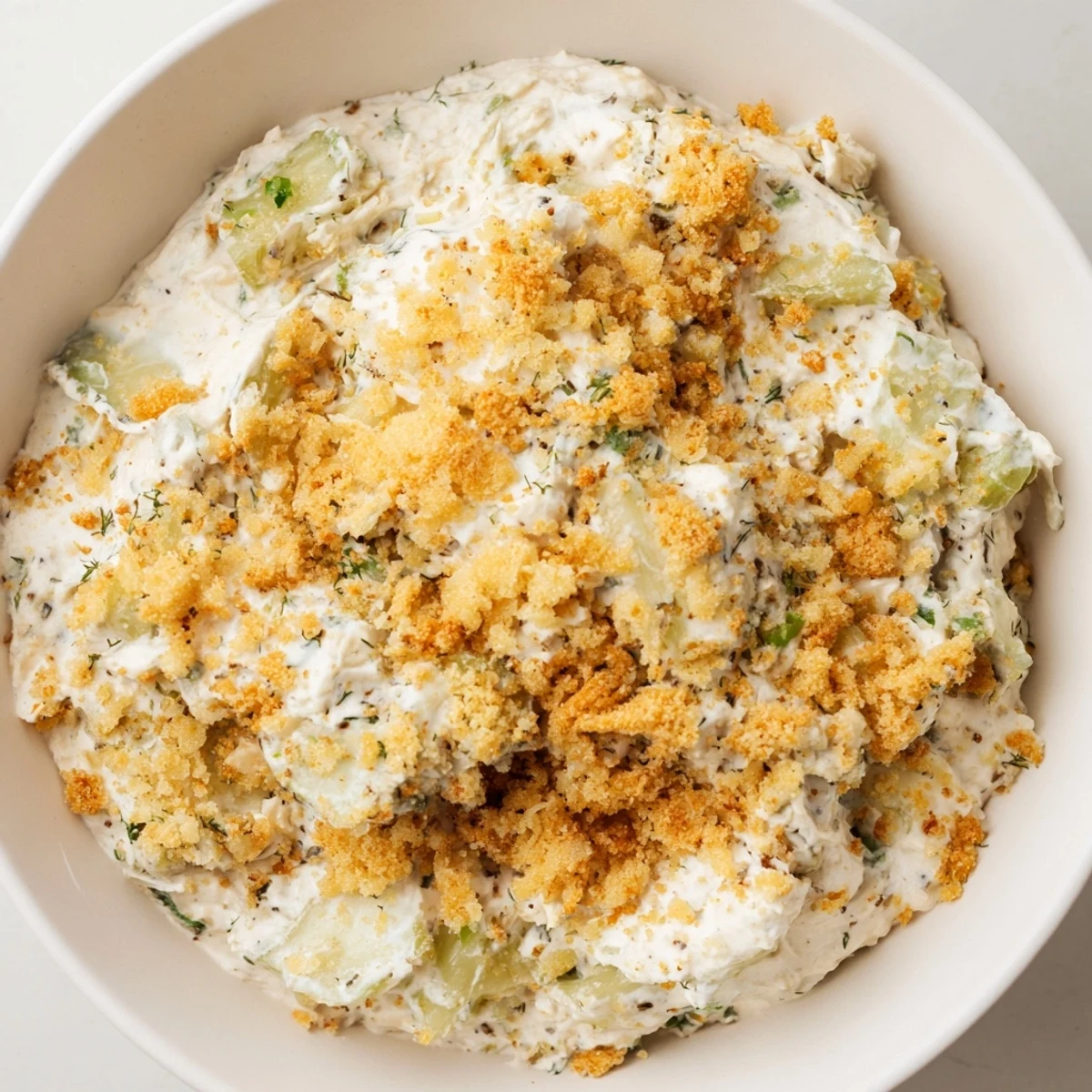 Enjoy a scoop of tangy Fried Pickle Dip, perfect with chips and refreshing veggie sticks.