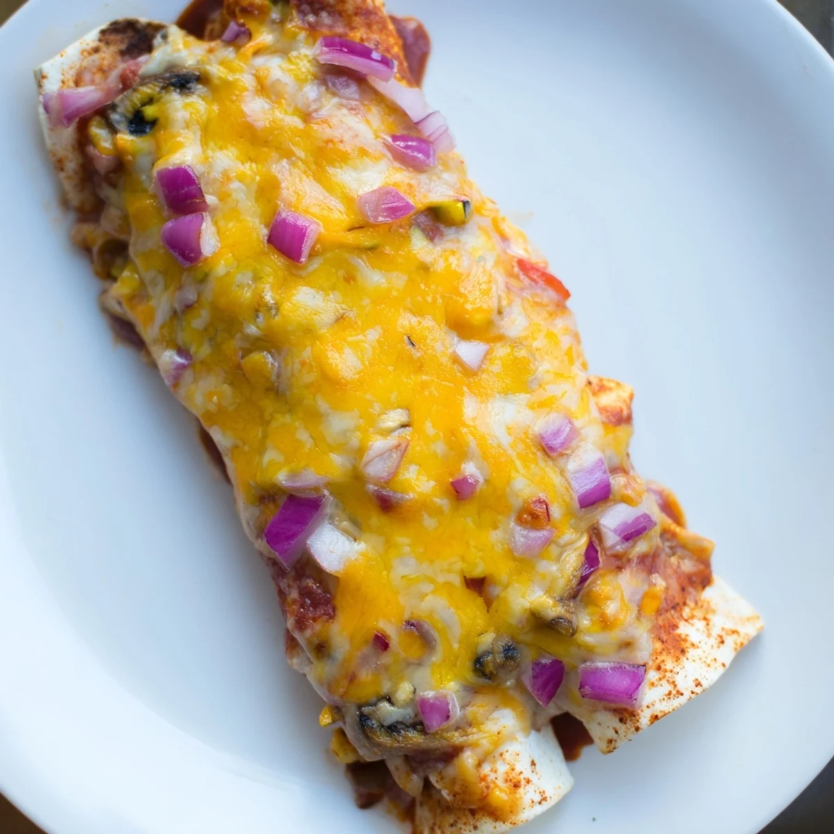 Freshly baked Farmers Market Vegetarian Enchiladas, loaded with colorful vegetables, served with toppings.