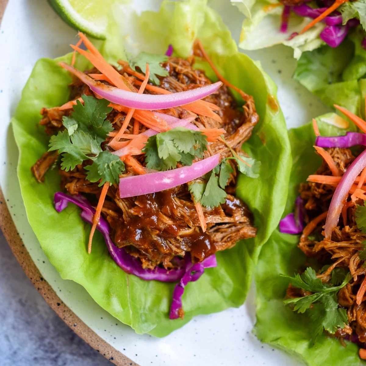 Imagine the flavorful BBQ Jackfruit Lettuce Wraps: juicy jackfruit and fresh veggies wrapped in a cool leaf.