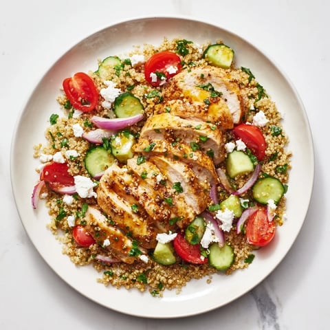 Bright, colorful Lemon Dijon Chicken & Quinoa Salad, featuring tender chicken and fresh vegetables.
